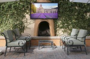 Image is of a home’s outdoor backyard and patio.