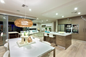 Image is of a kitchen with various lighting fixtures on the ceiling.
