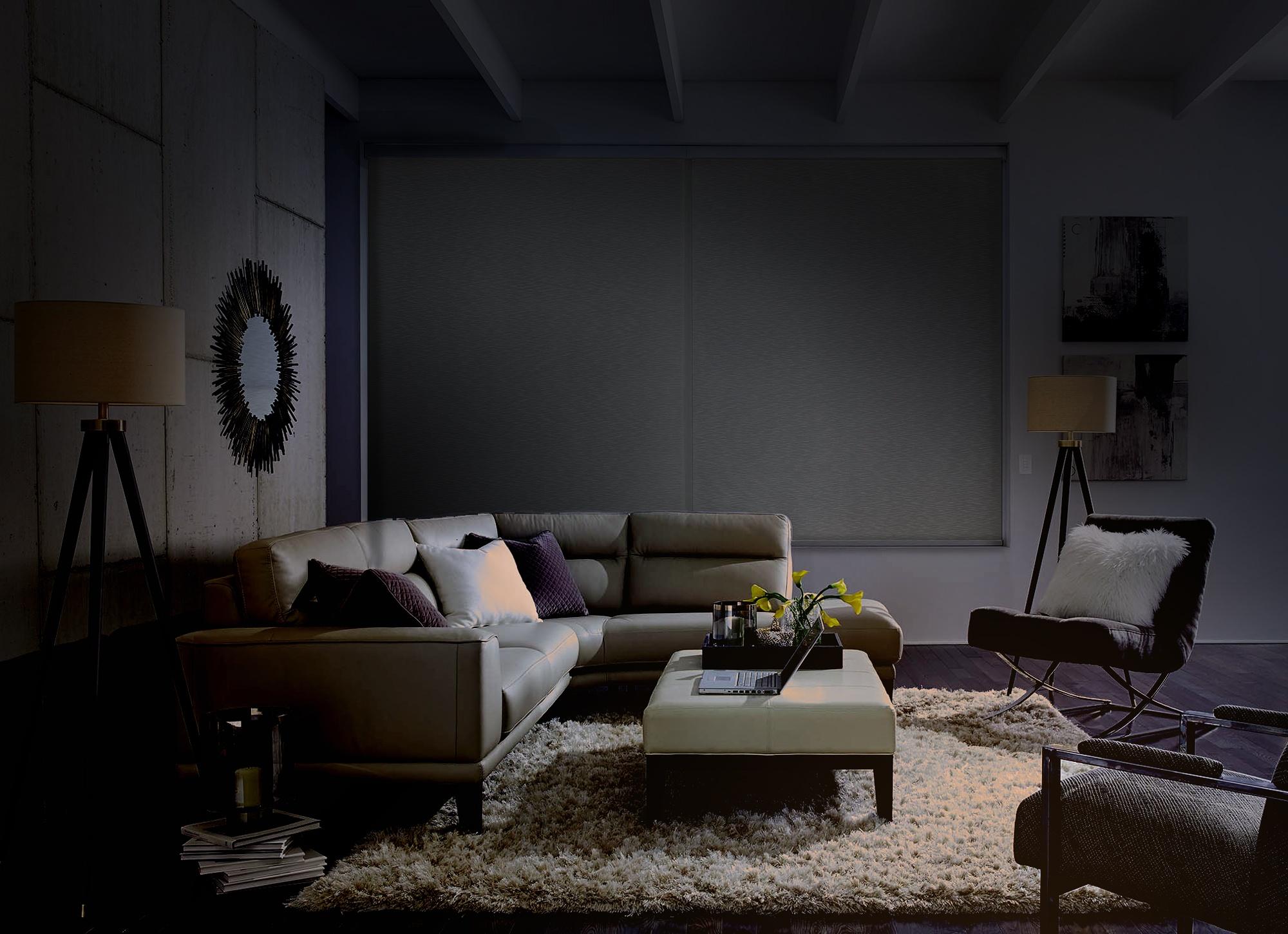 Darkened living room set for a movie night with a cozy, intimate setting.